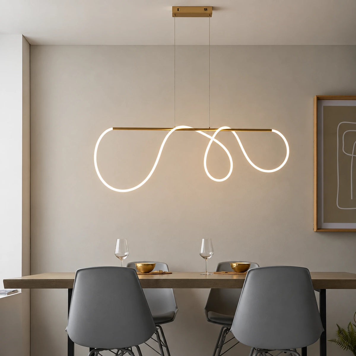 Looped ribbon linear pendant in a refined dining setting