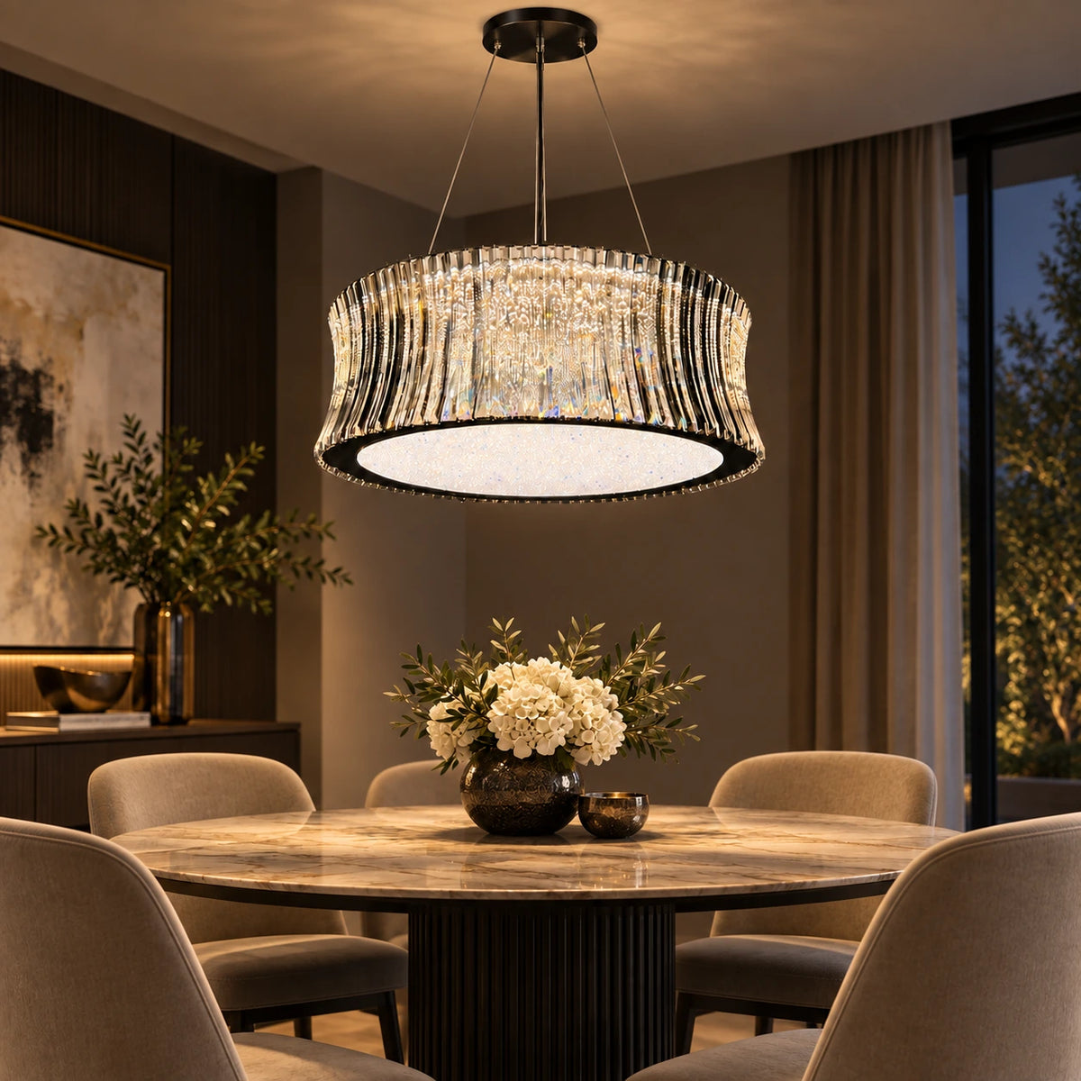 Smoked faceted drum chandelier above a refined dining table