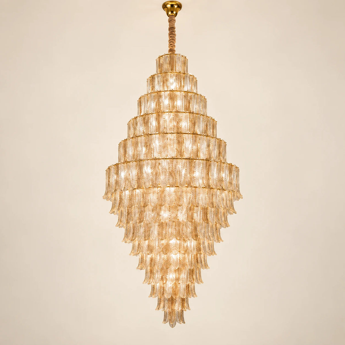 Tiered ribbed glass cascade chandelier on a clean studio background