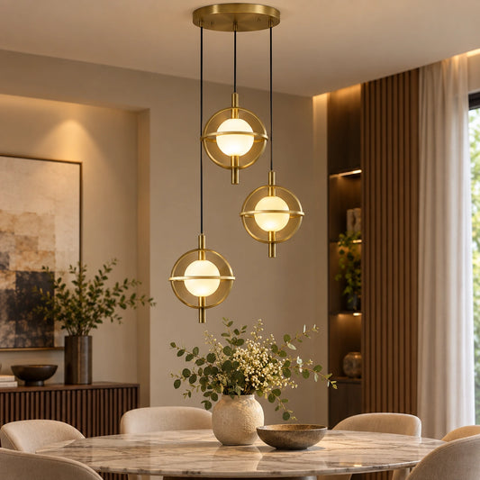 Three-globe ring cluster pendant above a dining table