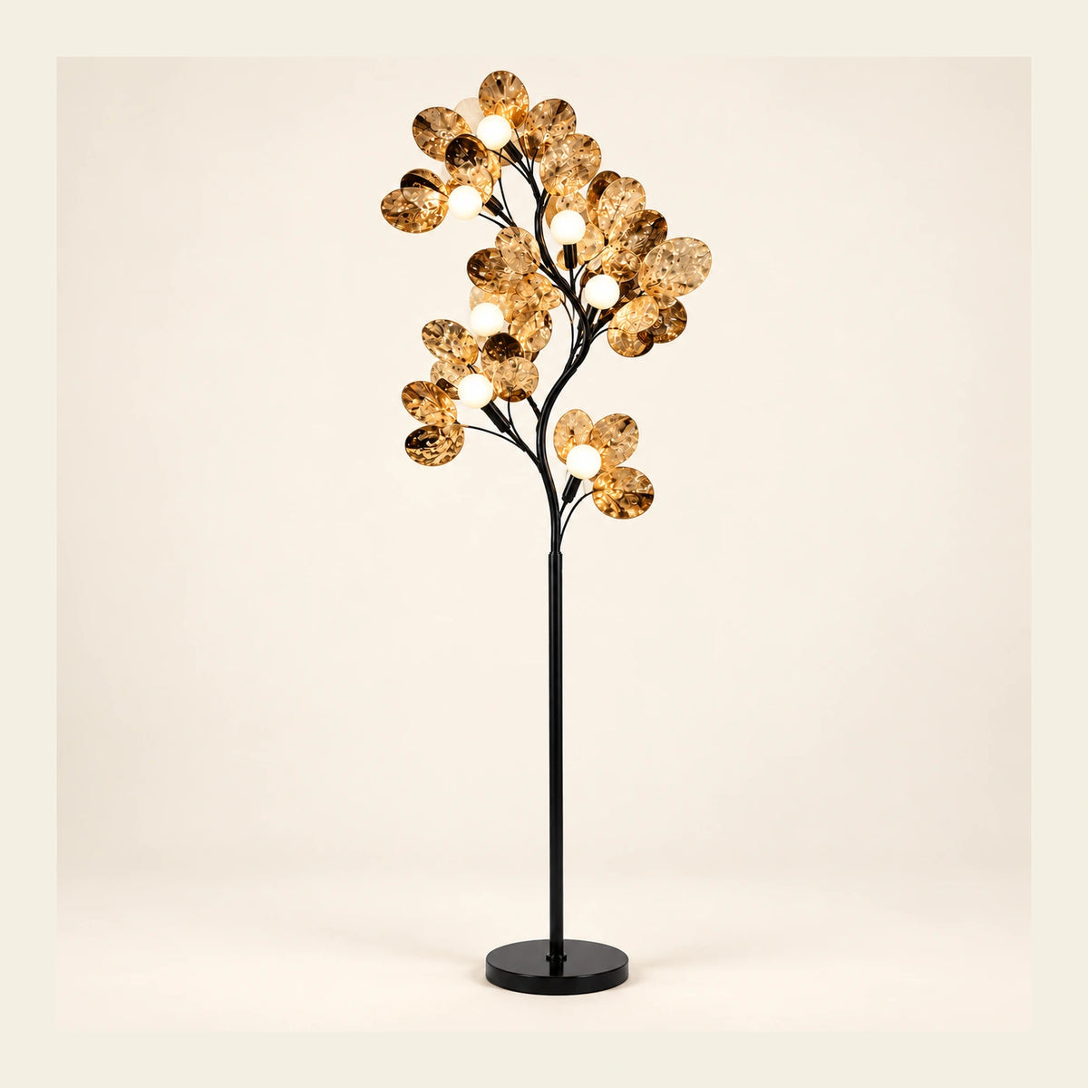 Branching globe floor lamp on a warm studio background