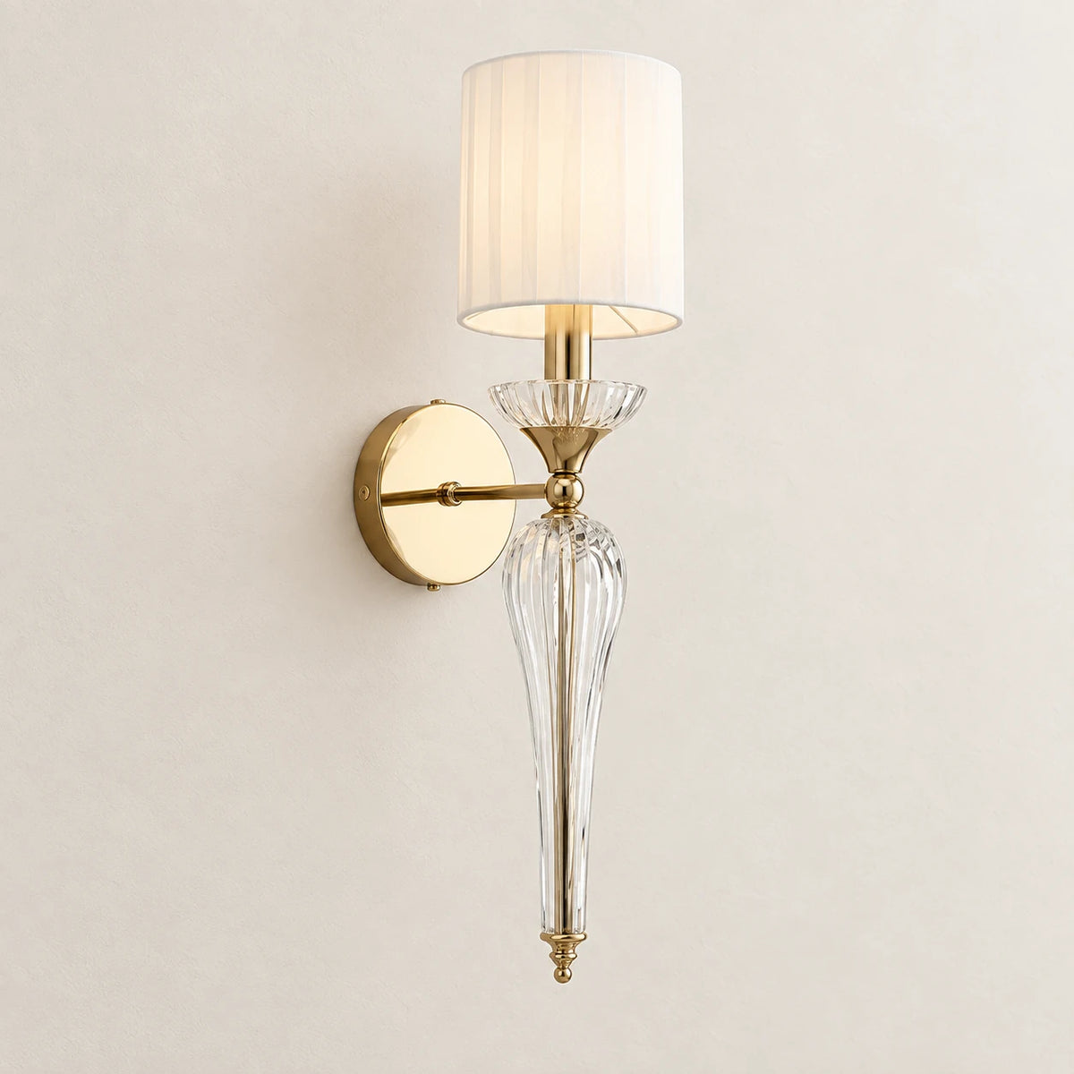 Faceted clear-stem shade wall sconce on a clean studio background