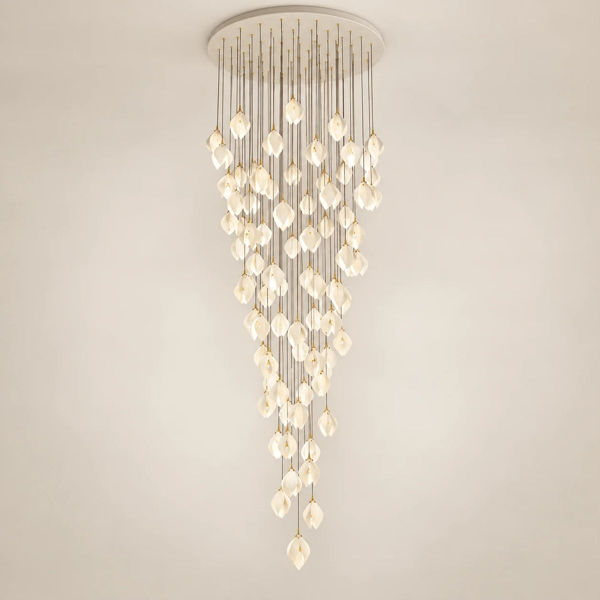 Cascading white petal double-height chandelier on a clean studio background