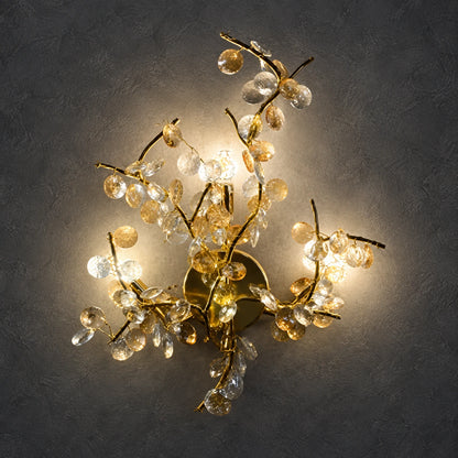 Illuminated floral-branch wall sculpture on a charcoal background