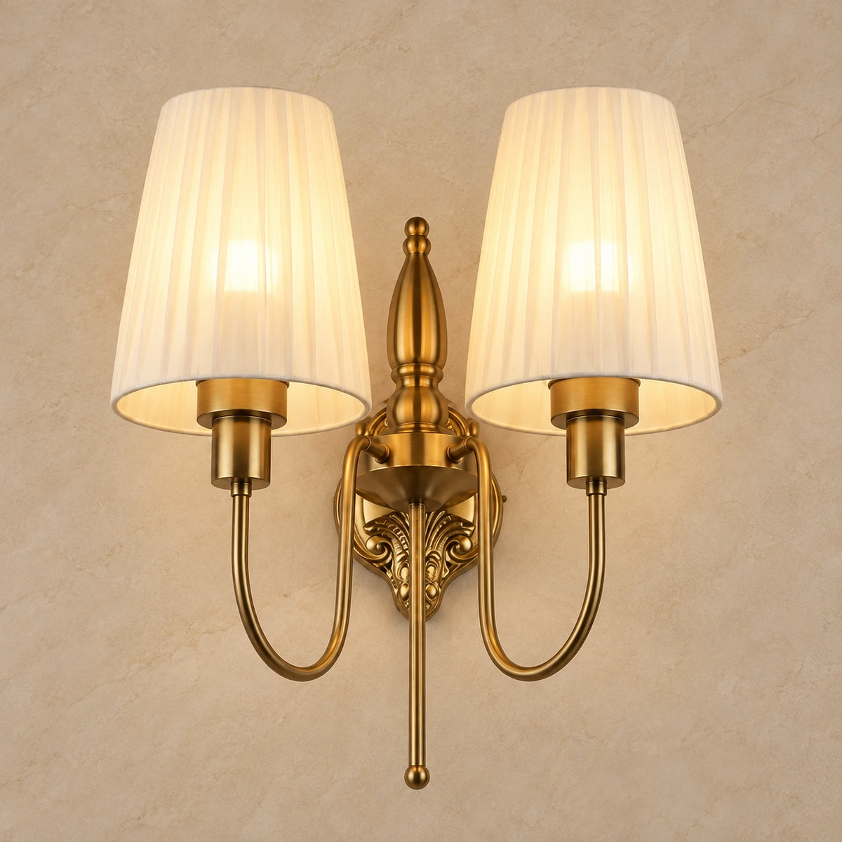 Twin pleated-shade wall sconce on a warm neutral background