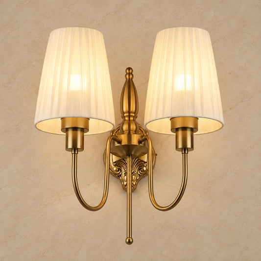 Twin pleated-shade wall sconce on a warm neutral background
