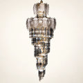 Tiered smoked glass crystal chandelier on a clean studio background
