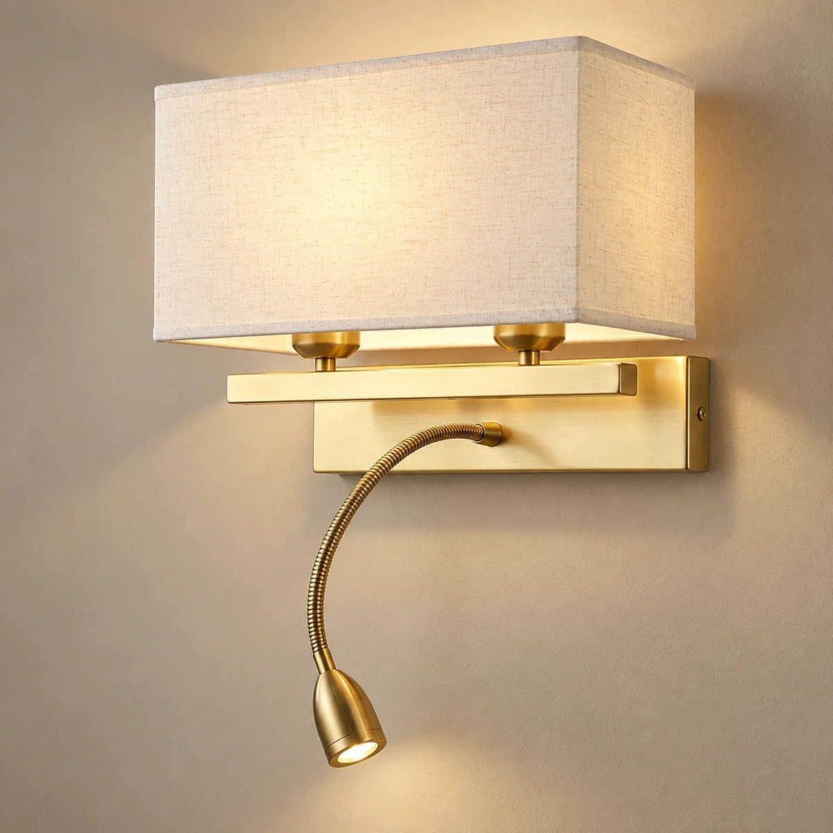 Fabric-shade wall light with flexible reading light on a warm neutral background