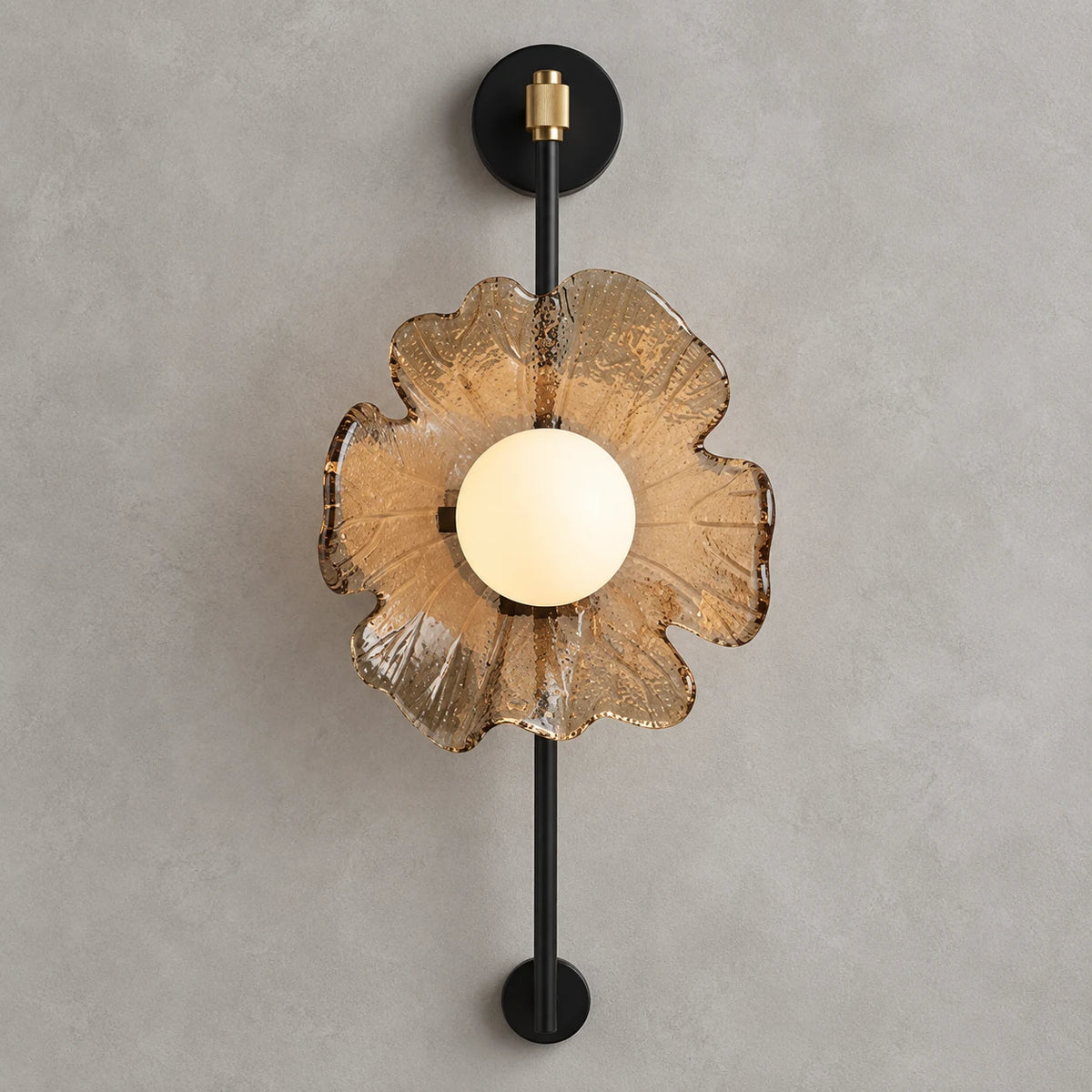 Textured petal globe wall sconce on a clean studio background