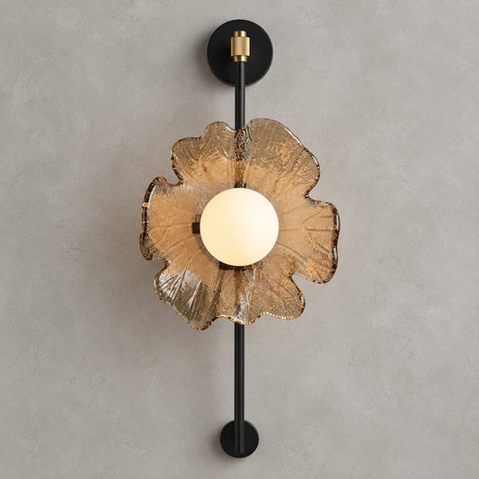 Textured petal globe wall sconce on a clean studio background