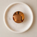 Generated product rendering of White / Rose Gold Orbis Curv wall light, based on supplier video